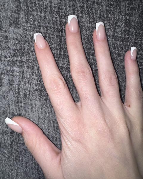 Classic white French tip nails on a natural pink base, done at 88 Nails in Lewisville, TX