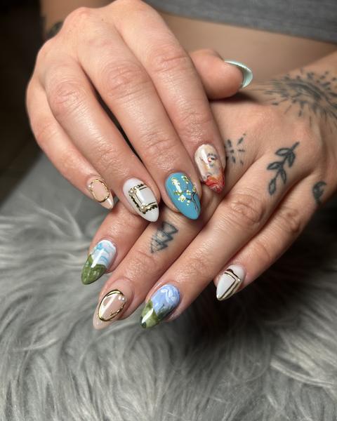 Museum-inspired nail art with tiny hand-painted landscapes and gold frames on almond nails from 88 Nails in Lewisville